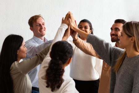 4happy-people-high-fiving-each-other-group-therapy-session