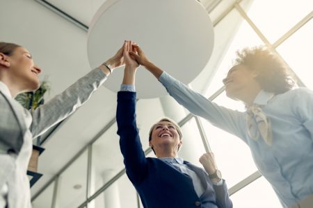 7view-happy-businesswomen-gathering-hands-unity